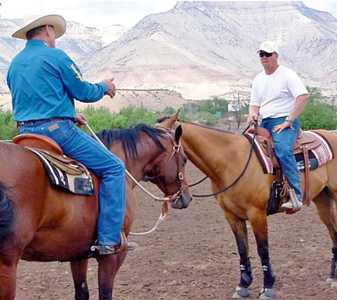 John Lyons giving advanced training to Raye Lochert