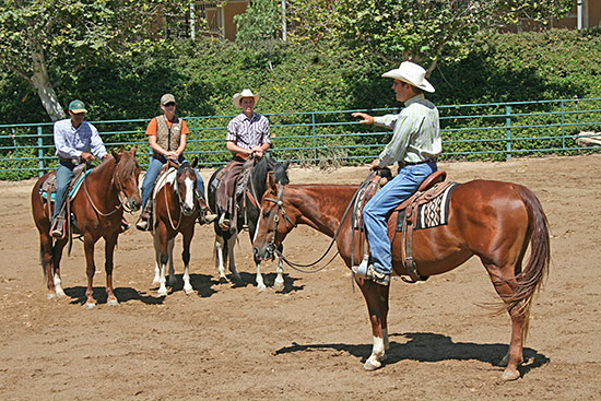Three aspiring trainers listening to my horsemanship speech.
