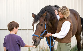 Family and friends with horses