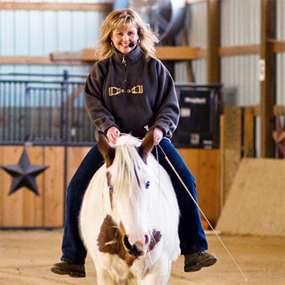 Horse Clinician using a microphone to speak to spectators