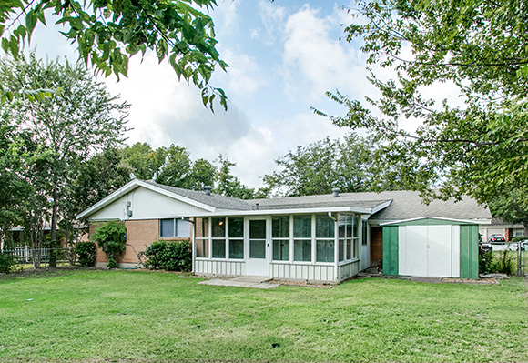 back of house with large back yard,