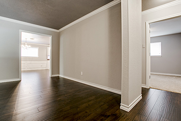 hardwood laminite entry ,living  room, kitchen, hall, and dining.