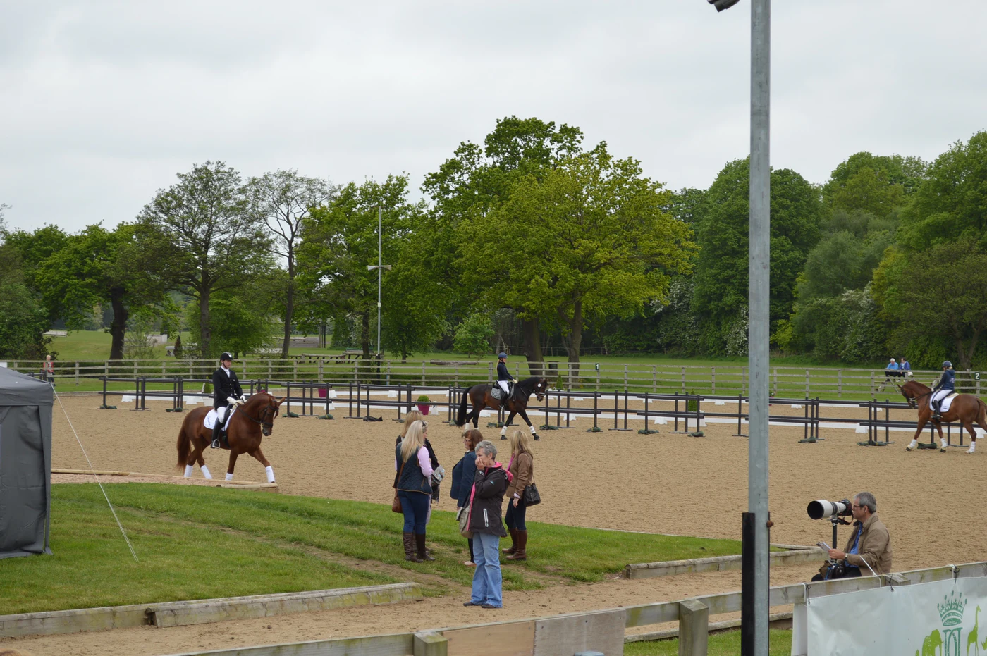 Multiple dressage combinations sharing the warm-up at Somerford Park Premier League Dressage