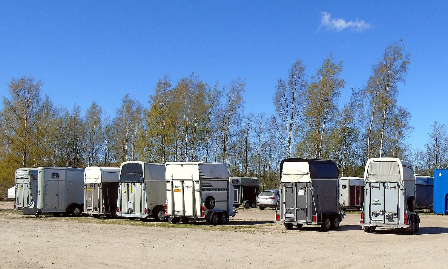 Horse trailers parked at an equestrian facility