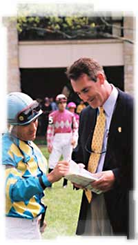Equine attorney Bing I. Bush, Jr. in the Keeneland paddock with jockey Corey Nakatani