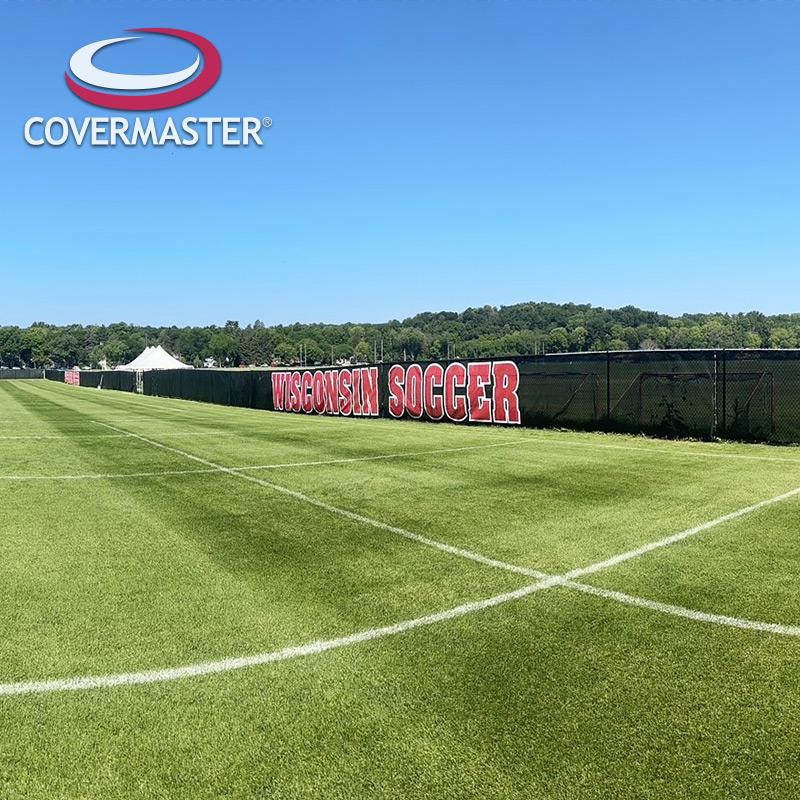 Covermaster WINDMASTER PRO mesh windscreen panel with reinforced hem and brass grommets on horse arena fencing