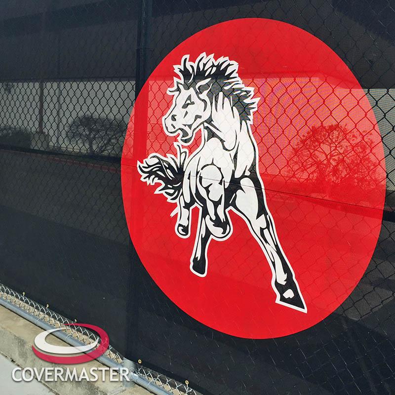WINDMASTER PRO windscreen providing privacy and wind reduction around an outdoor riding arena