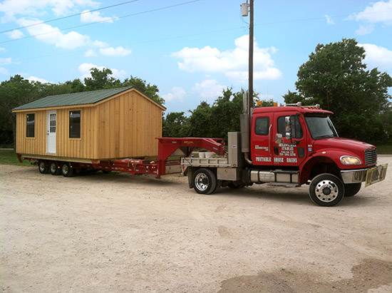 Deer Creek Structures portable cypress cabin with metal roof