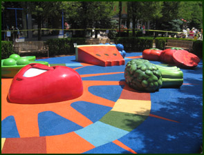 Playground surfaced with colorful Equi-Turf poured rubber flooring