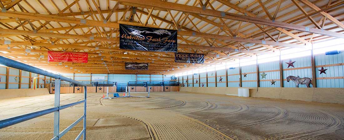 Wide view of an equestrian arena equipped with an Equine-Audio sound system