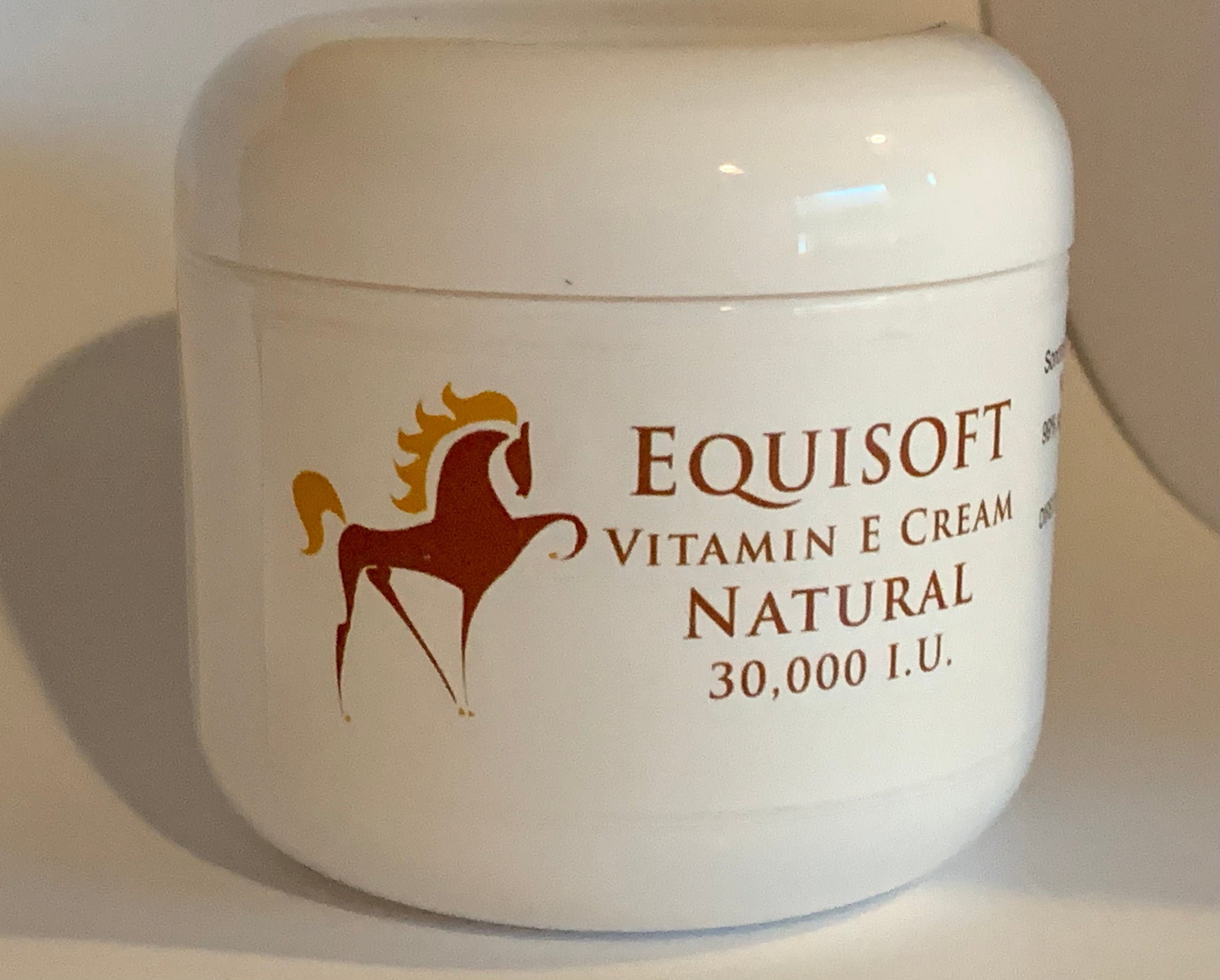 Jar of Equisoft Vitamin E Cream Natural 30,000 IU showing the prancing horse emblem