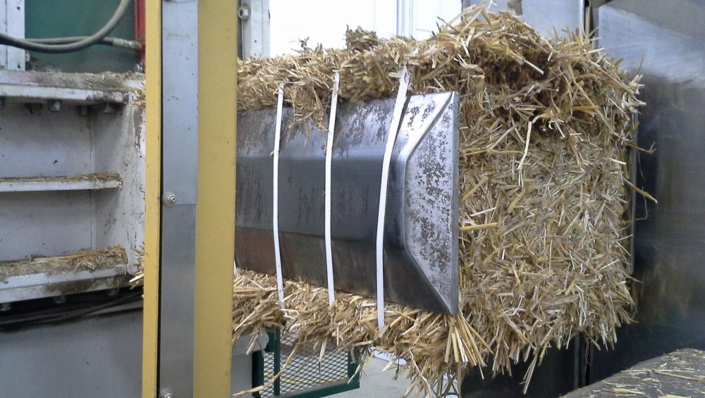 Flack Farms Steffen Bale Converter cutting big square bales into small bales