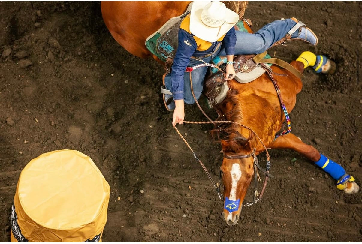 Barrel racer Tayla Moeykens competing on a horse wearing a FLAIR nasal strip
