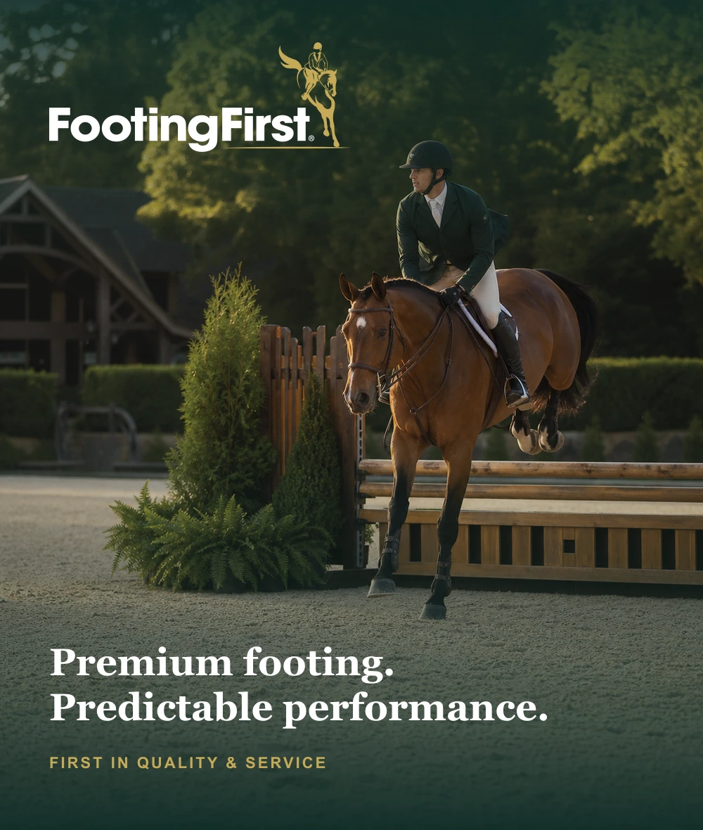 FootingFirst premium horse arena footing with an English rider in a meticulously groomed indoor arena
