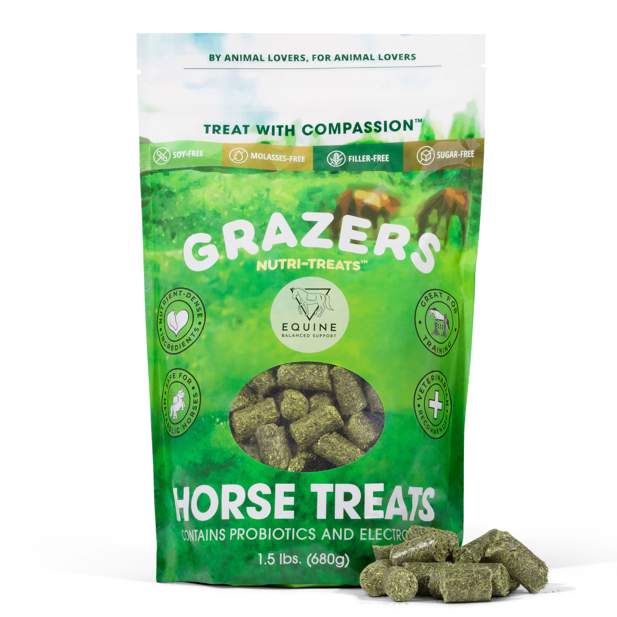 Front of the 1.5 lb GRAZERS Nutri-Treats bag showing the soy-free, molasses-free, filler-free and sugar-free seals beside a pile of green forage treats
