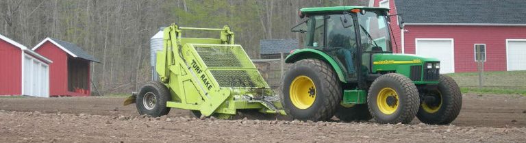 H. Barber & Sons TURF RAKE preparing a farm seedbed by removing stones