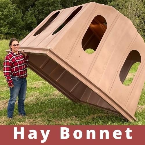 Covered horse hay feeder Hay Bonnet protecting a round bale from weather