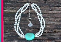 Hi Yo Turquoise braided freshwater pearl necklace with a large turquoise pebble centered in the strands