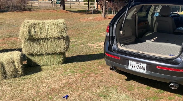 Clean SUV cargo area after transporting hay with the Keep It Clean Cargo Liner