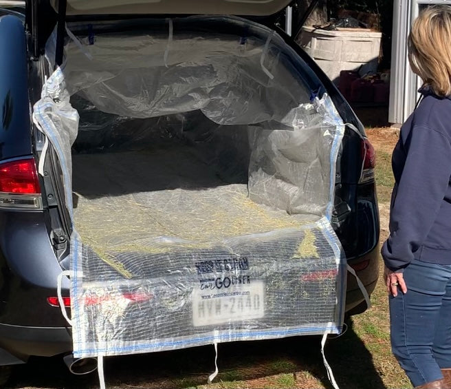 Keep It Clean Cargo Liner containing loose hay debris after unloading
