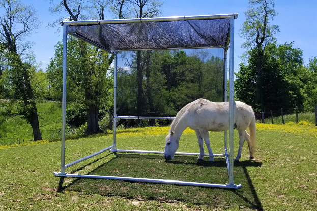 Klene Pipe Structures portable horse Shade Kit with galvanized steel frame and 86% UV-block shade cloth in pasture