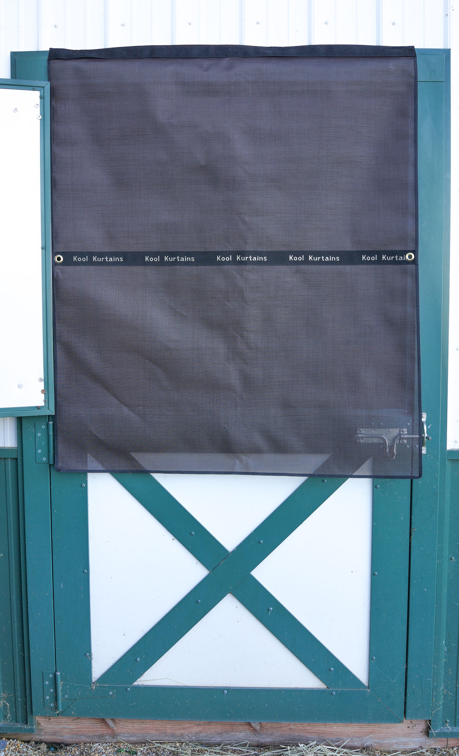 Dark Bay Kool Kurtains Dutch Door curtain installed on a horse stall door