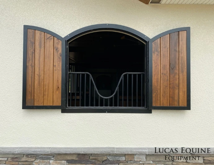 Lucas Equine custom steel barn window with grid pattern and natural light