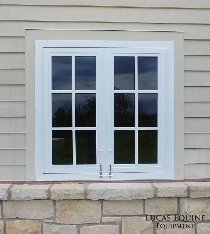 Lucas Equine custom barn window with stainless steel continuous hinge open for ventilation