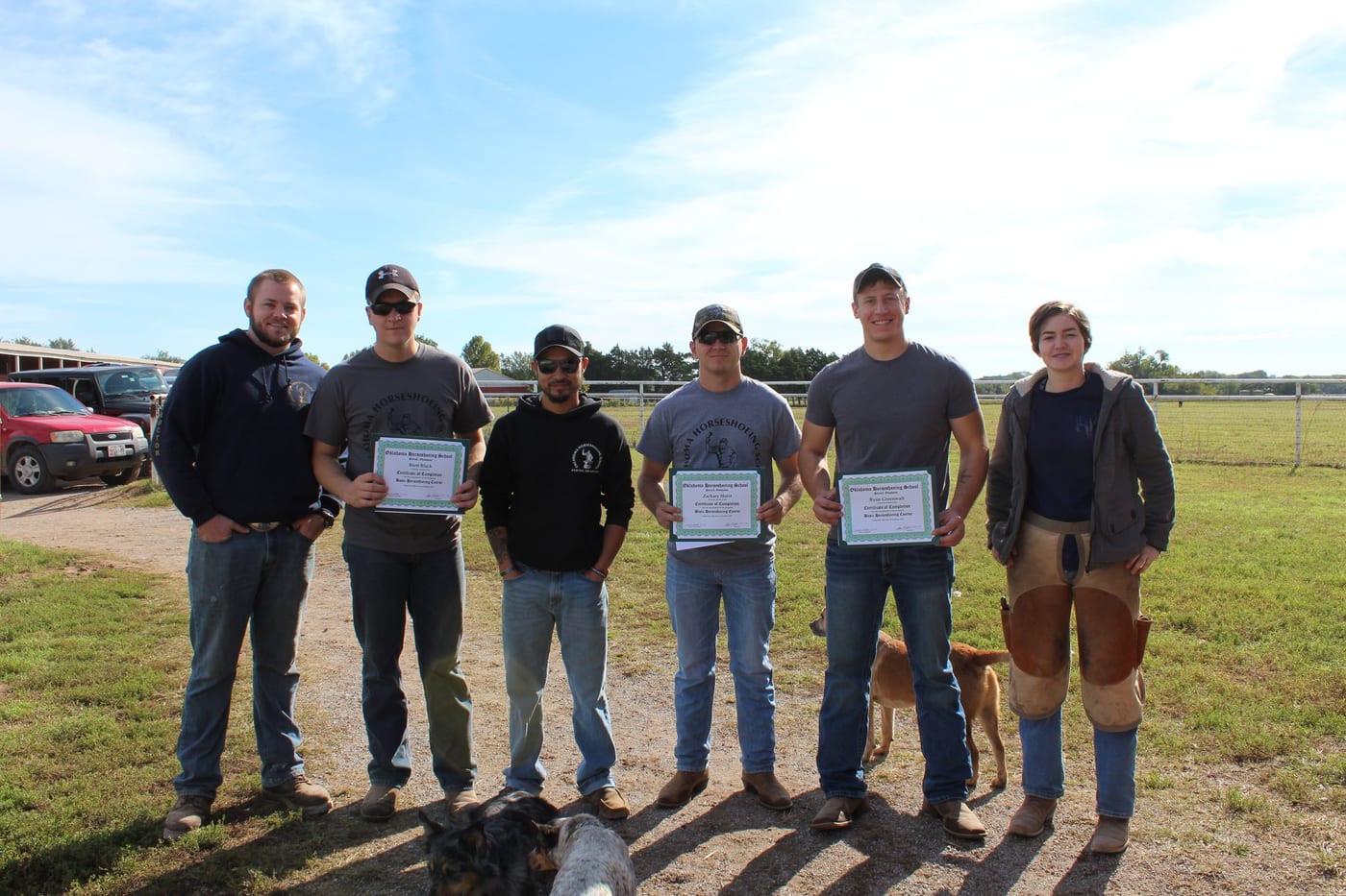 Oklahoma Horseshoeing School graduates holding their course completion certificates