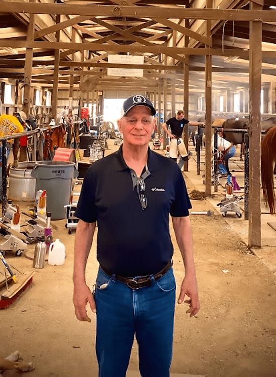 Standing inside the working shoeing barn at Oklahoma Horseshoeing School