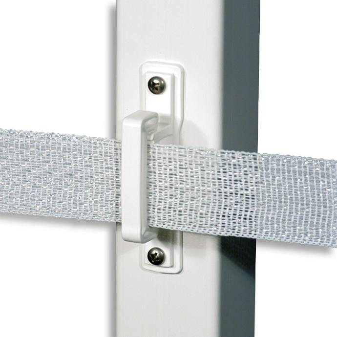 A Safe-Fence insulator screwed to a post, holding 1.5-inch polytape flat across its full width