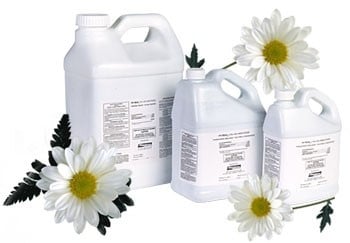 Py-Tech pyrethrum insecticide concentrate bottles with chrysanthemum flowers by Pro-Tech