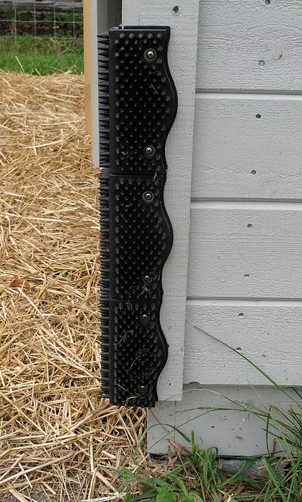 ScratchnAll pads installed on a barn corner in a donkey shed