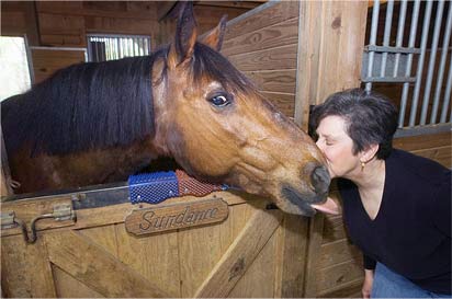 ScratchnAll founder Cynthia Garry-Jones with her horse Sundance