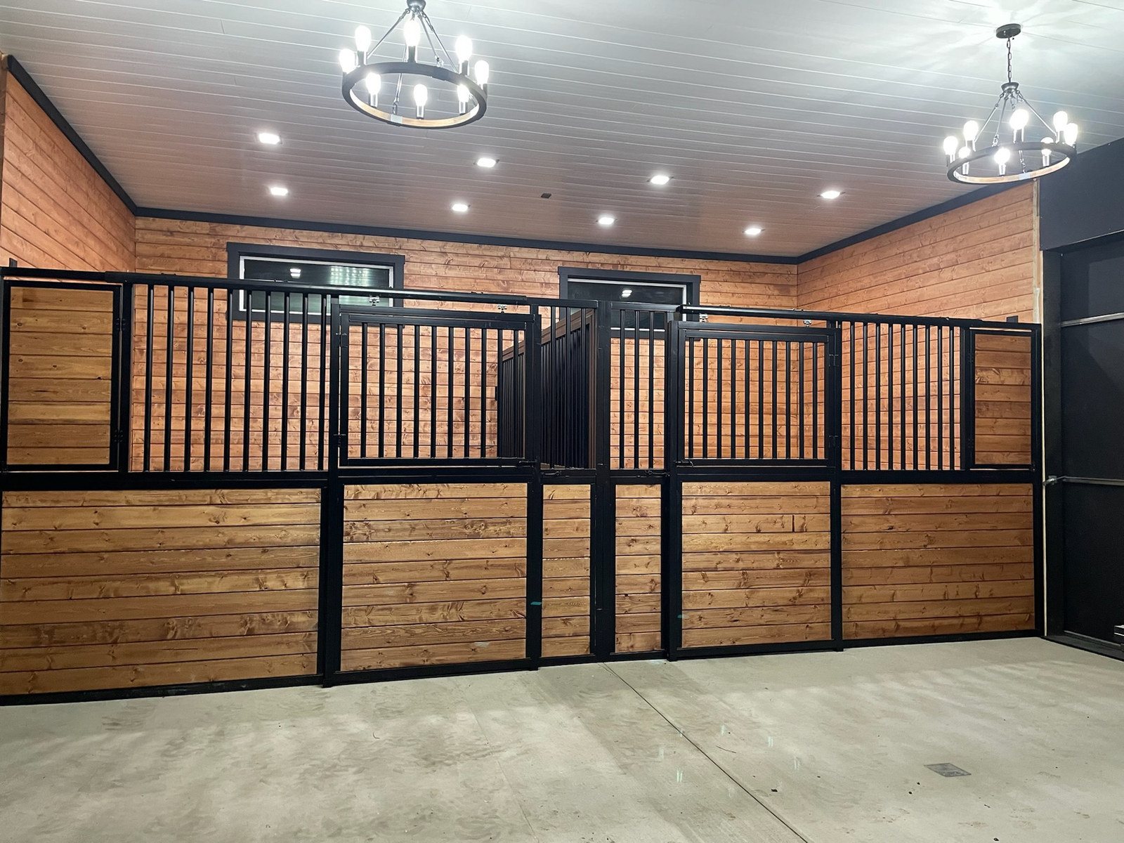 Premium Selkirk stall fronts in wood and black steel under pendant lighting