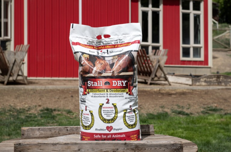 Stall DRY absorbent deodorizer spread across stall bedding for odor and moisture control