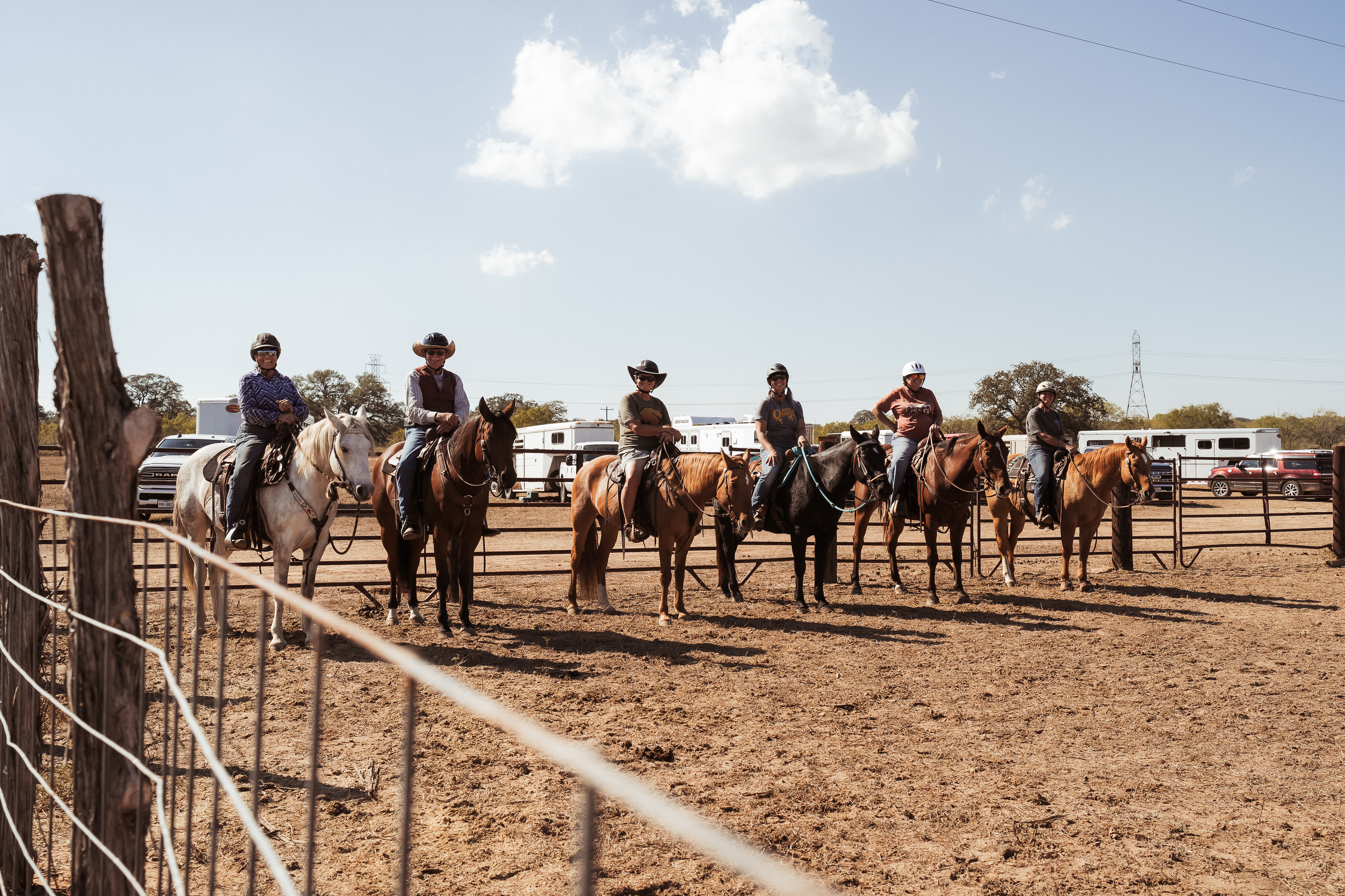 Group of mounted riders lined up in the arena at Steady Horse clinic at Grace Ranch Texas
