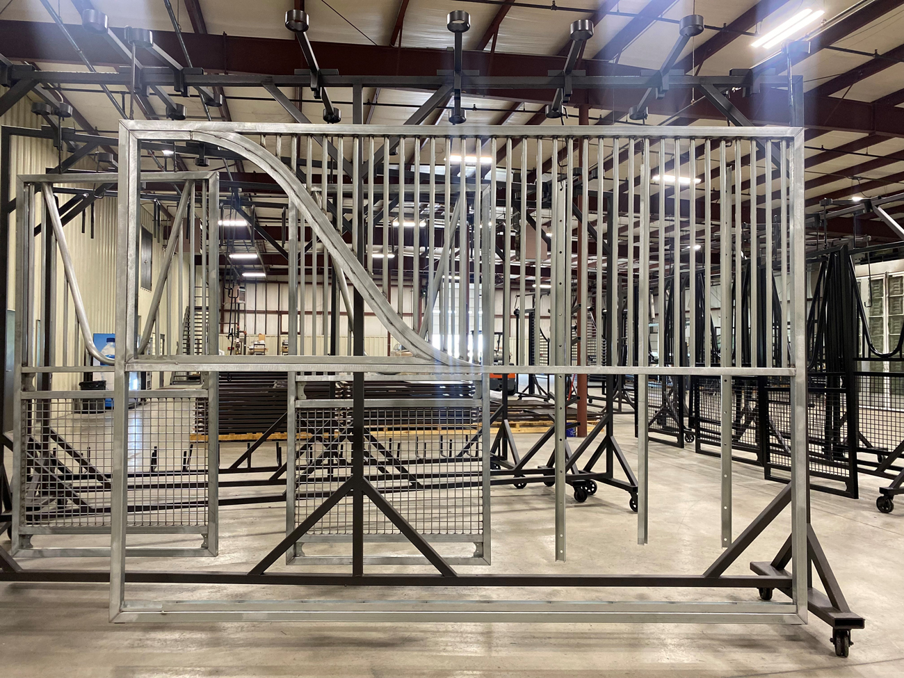 Sterling-Equine custom horse stall partition in finished barn aisle