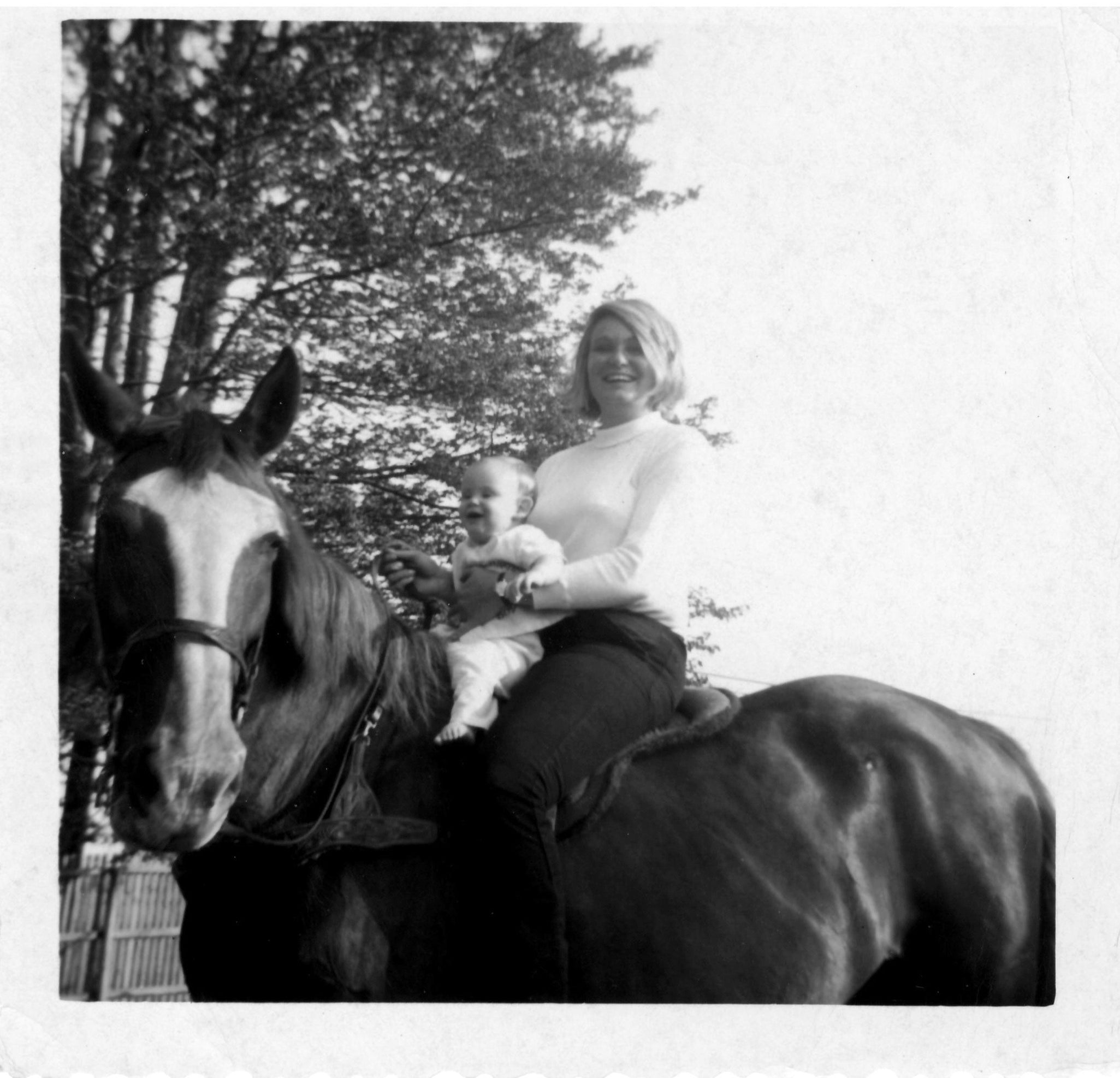 Straight Arrow founder Bonnie Katzev with baby Devon on horseback