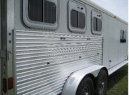 Brightened aluminum horse trailer after cleaning with Streak Master aluminum trailer cleaner