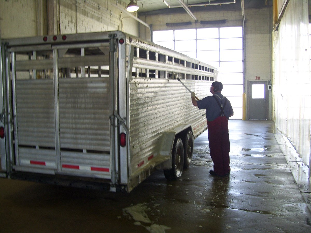 Aluminum trailer being washed and brightened with Streak Master cleaner