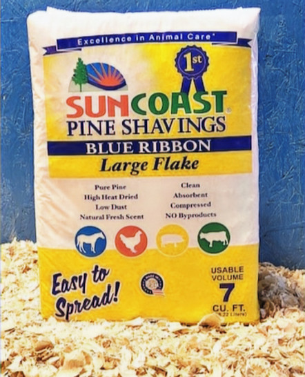 SUNCOAST pure pine shavings bedding spread in a horse stall