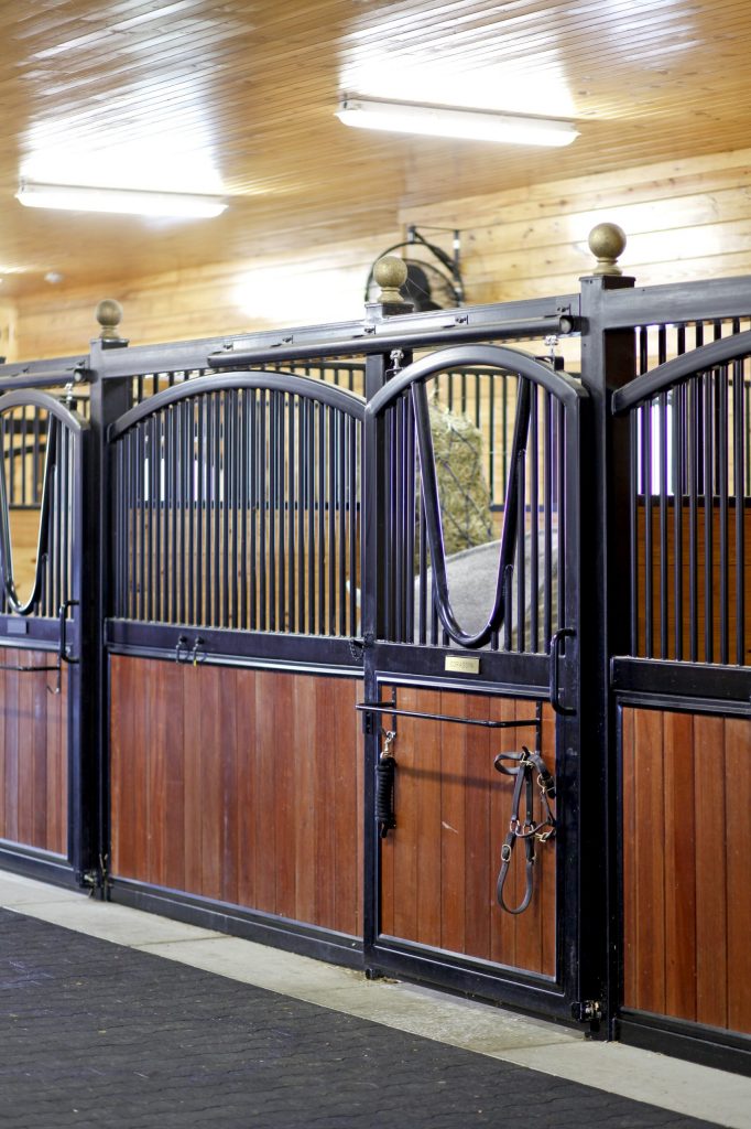 Sunset Valley Metal Craft custom arched stall front with grille bars