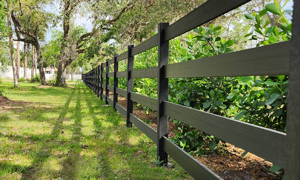 Tangent recycled HDPE Split Rail and Ranch Rail horse fence enclosing a pasture