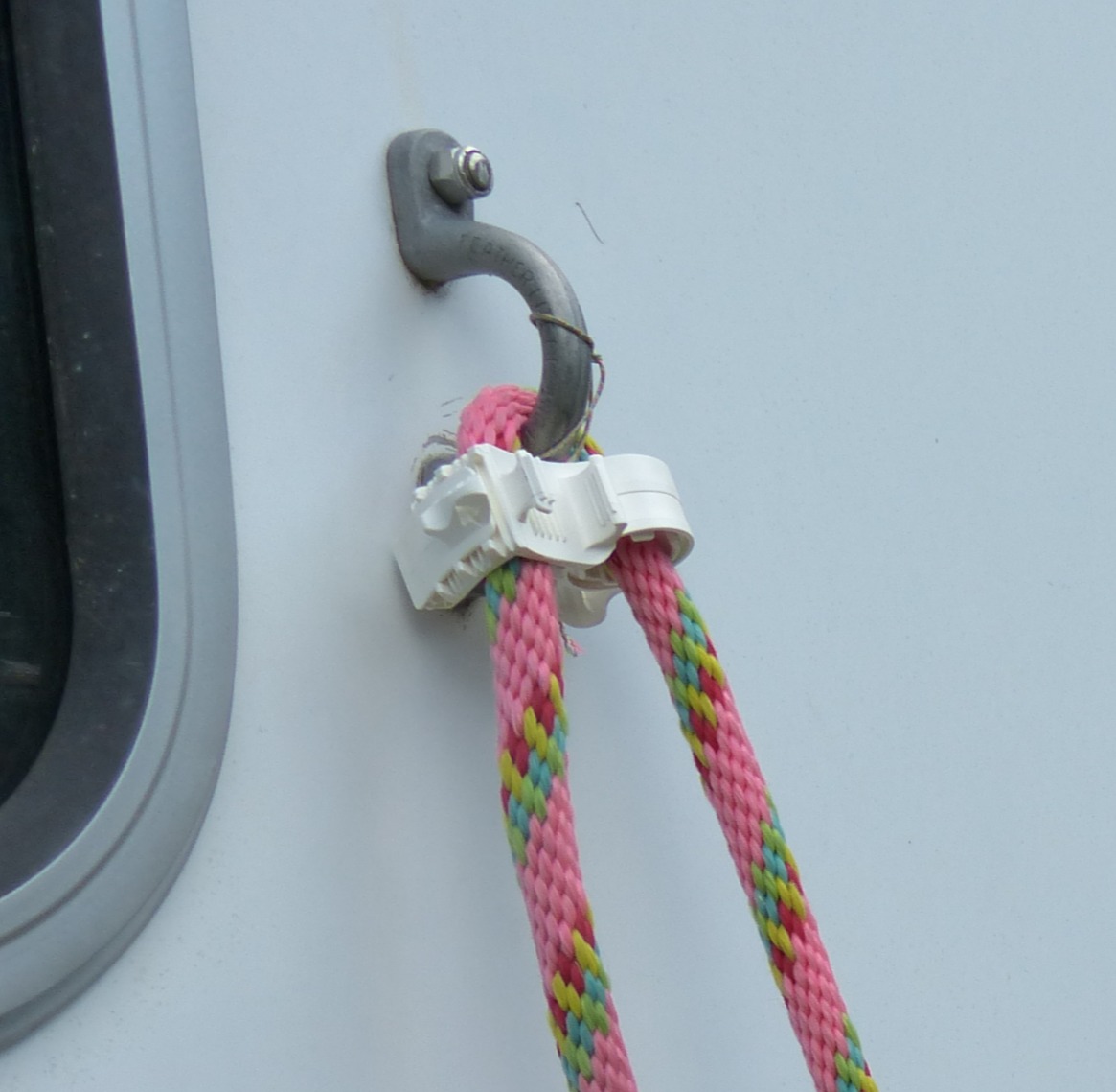 Close-up product detail of the patented Tie Ease by Rope Lock pocket-sized horse tie device