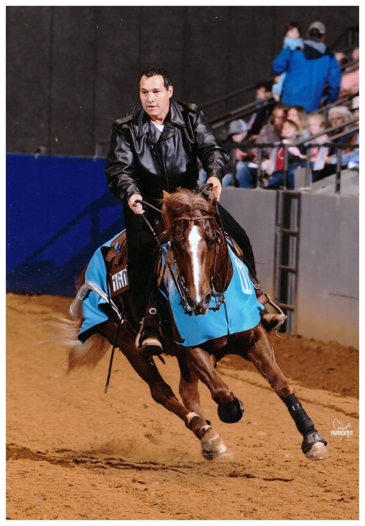Tim Anderson working a reined cow horse on the ranch