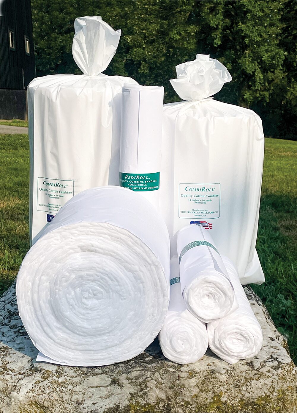 CombiRoll and RediRoll cotton combine bandage rolls and packaged bulk rolls displayed outdoors