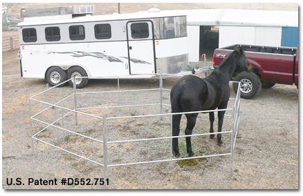 Travel N Corrals 13x13 single round portable corral assembled on a gravel lot beside a horse trailer