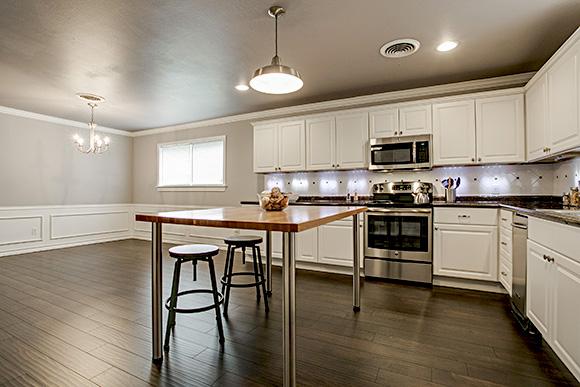 Butcher block island in big kitchen